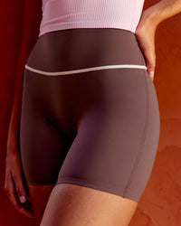 Woman wearing Pinnacle High-Rise 6" Short - Cocoa Powder-Off White | Model:Taneisha | Size:XS