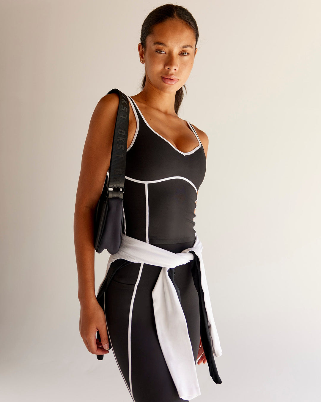 Woman wearing Power Sweetheart Shelf Bra Tank - Black | Model:Tali | Size:XS - view 1
