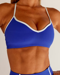 Woman wearing Power Sweetheart Sports Bra - Electric Indigo | Model:Charli | Size:XS | Thumbnail Index: 0