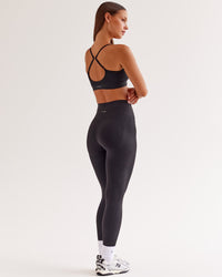 Woman wearing Surge Seamless High-Rise Full Length Legging - Black | Model:Brylee | Size:XS