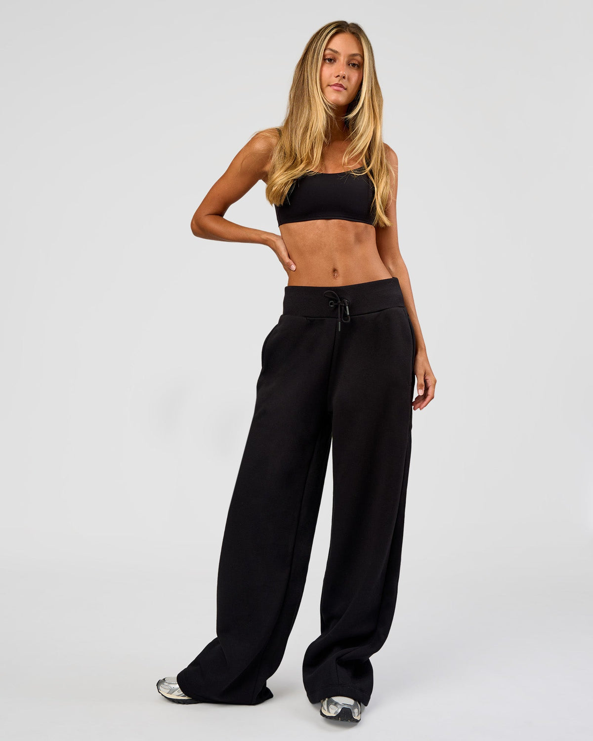 Woman wearing Go-To Wide Leg Track Pant Tall - Black | Model:Georgia | Size:XS