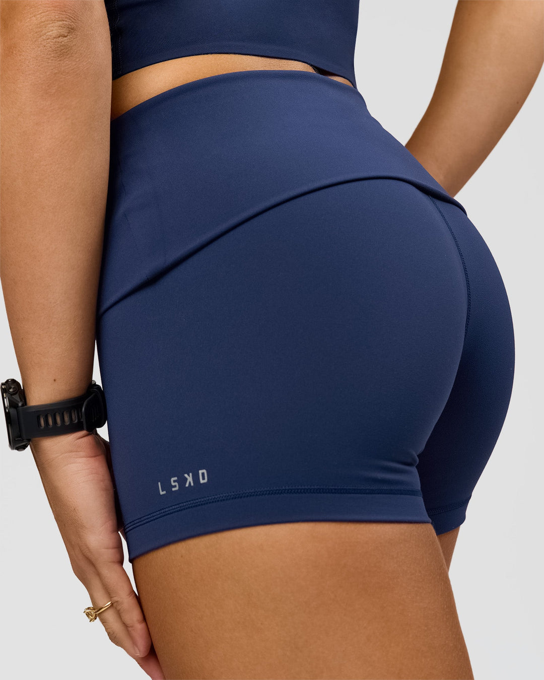 Woman wearing Groovy High Rise Fold Over 4" Short - Future Navy | Model:Grace | Size:XS
