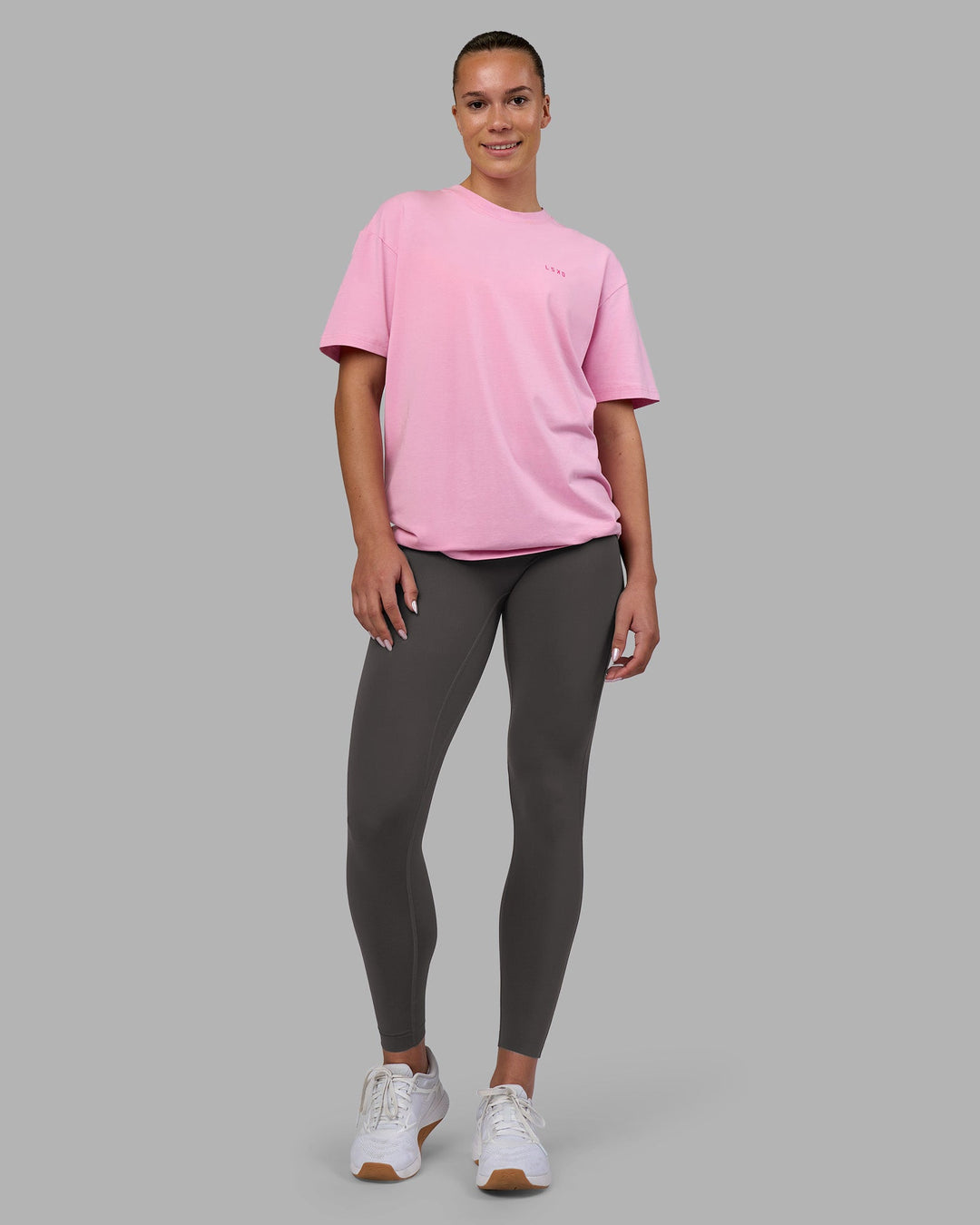 Woman wearing 1% Better Value Series FLXCotton Tee Oversize - Bubblegum-Ultra Pink | Model:Charlize | Size:XS