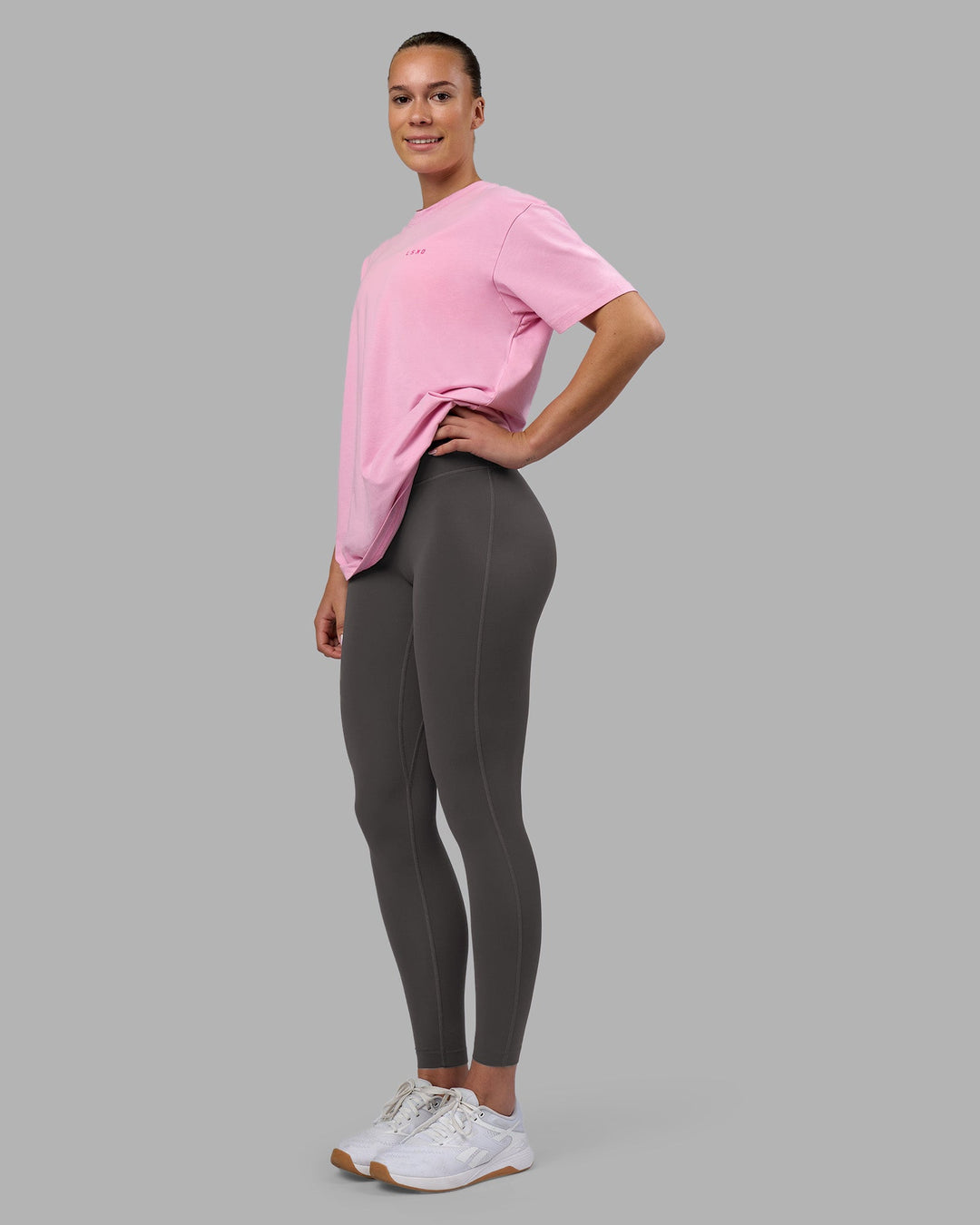 Woman wearing 1% Better Value Series FLXCotton Tee Oversize - Bubblegum-Ultra Pink | Model:Charlize | Size:XS