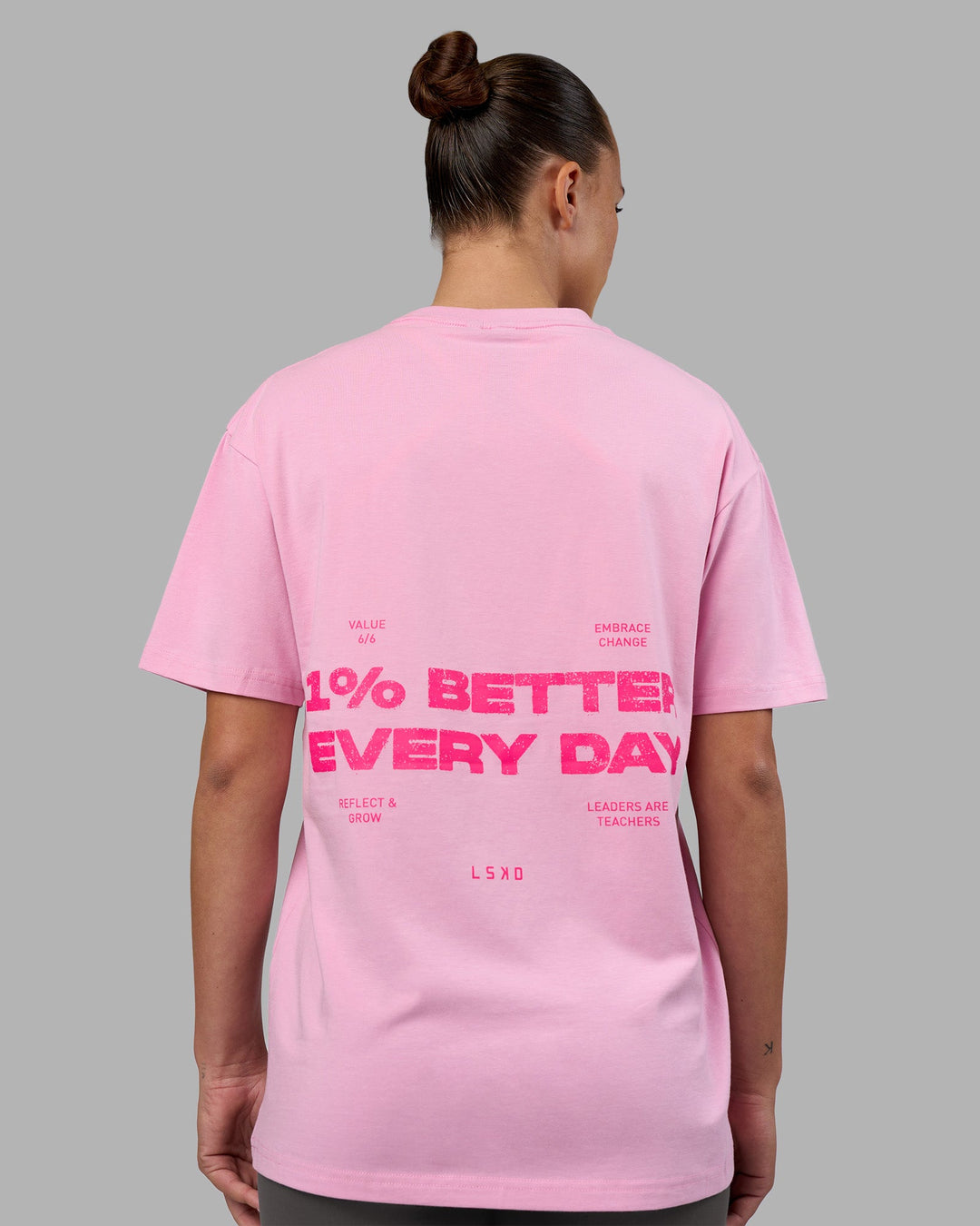 Woman wearing 1% Better Value Series FLXCotton Tee Oversize - Bubblegum-Ultra Pink | Model:Charlize | Size:XS