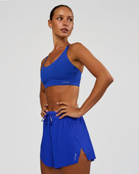 Woman wearing Accelerate 3" High-Rise Running Short - Electric Indigo | Model:Brylee | Size:XS