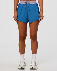Woman wearing Accelerate 3" High-Rise Running Short - Electric Indigo-Multi | Set:true | Angle:front | Model:Brylee | Size:XS