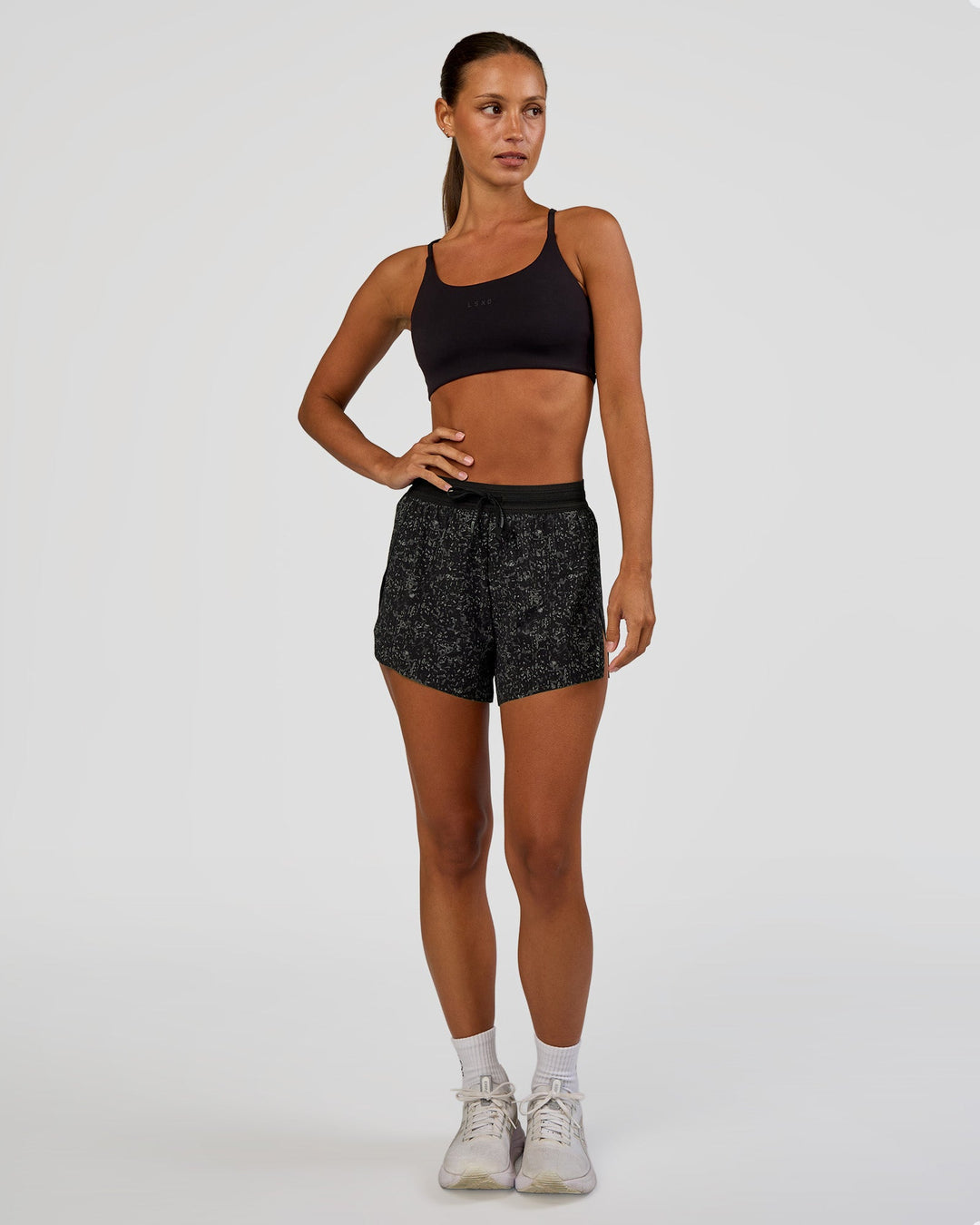 Woman wearing Accelerate 3" High-Rise Running Short - Energy Print Black | Model:Brylee | Size:XS - view 4