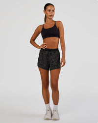 Woman wearing Accelerate 3" High-Rise Running Short - Energy Print Black | Model:Brylee | Size:XS | Thumbnail Index: 3
