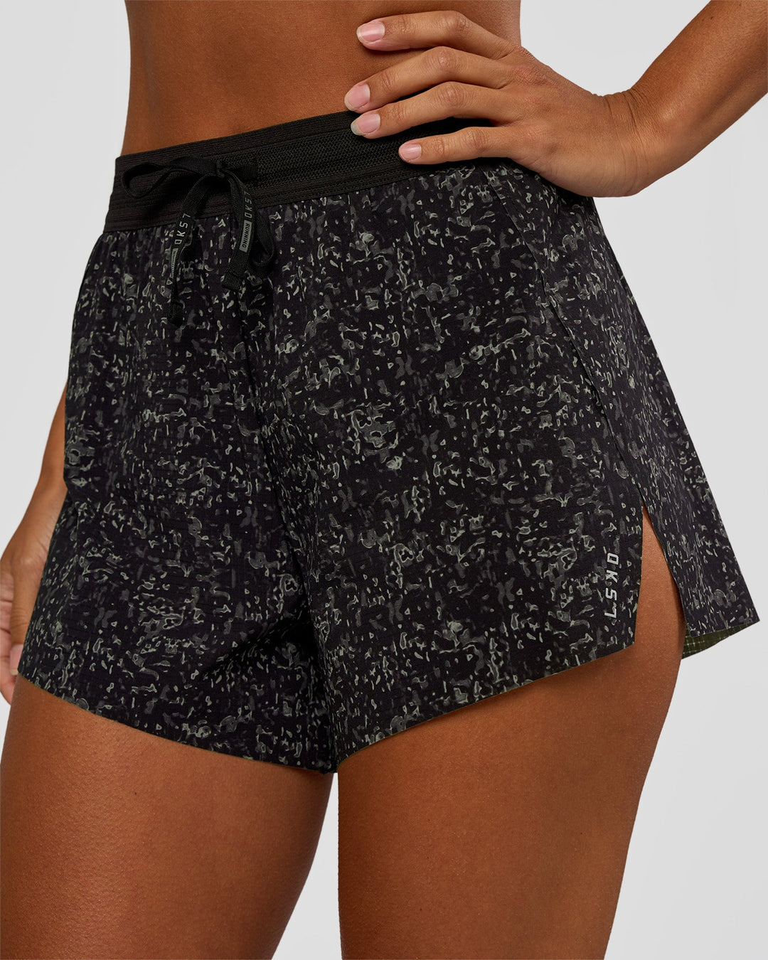 Woman wearing Accelerate 3" High-Rise Running Short - Energy Print Black | Set:true | Angle:closeup | Model:Brylee | Size:XS