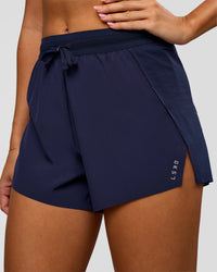 Woman wearing Accelerate 3" High-Rise Running Short in Future Navy | Model:Charli | Size:XS