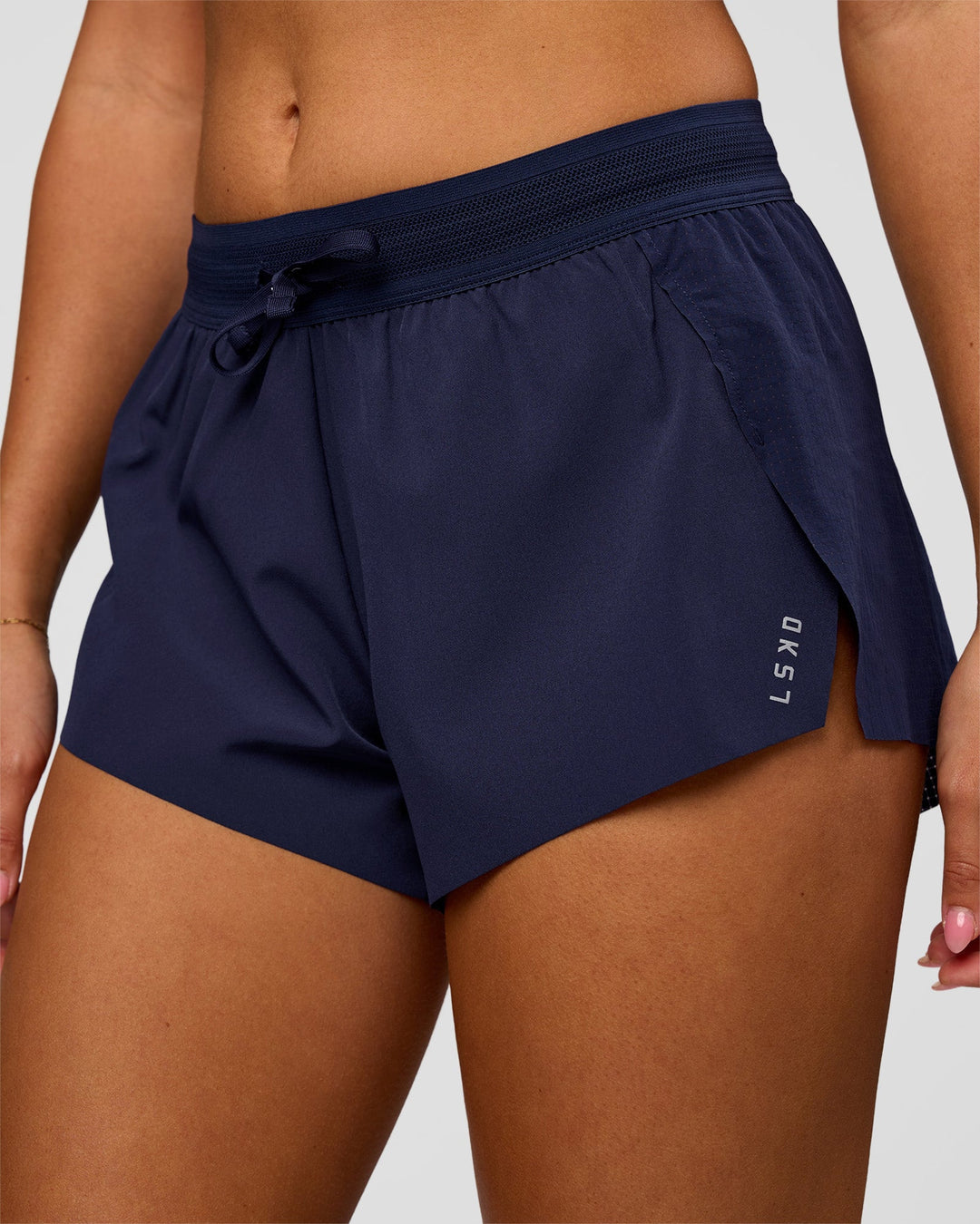 Woman wearing Accelerate 3" High-Rise Running Short in Future Navy | Model:Charli | Size:XS