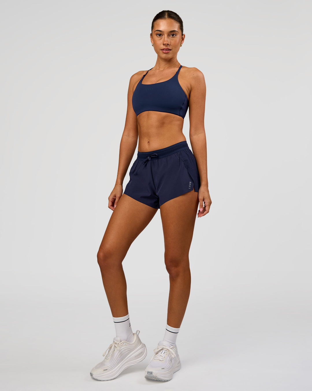 Woman wearing Accelerate 3" High-Rise Running Short in Future Navy | Model:Charli | Size:XS