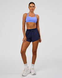 Woman wearing Accelerate 3" High-Rise Running Short in Future Navy | Model:Charli | Size:XS