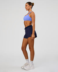 Woman wearing Accelerate 3" High-Rise Running Short in Future Navy | Model:Charli | Size:XS