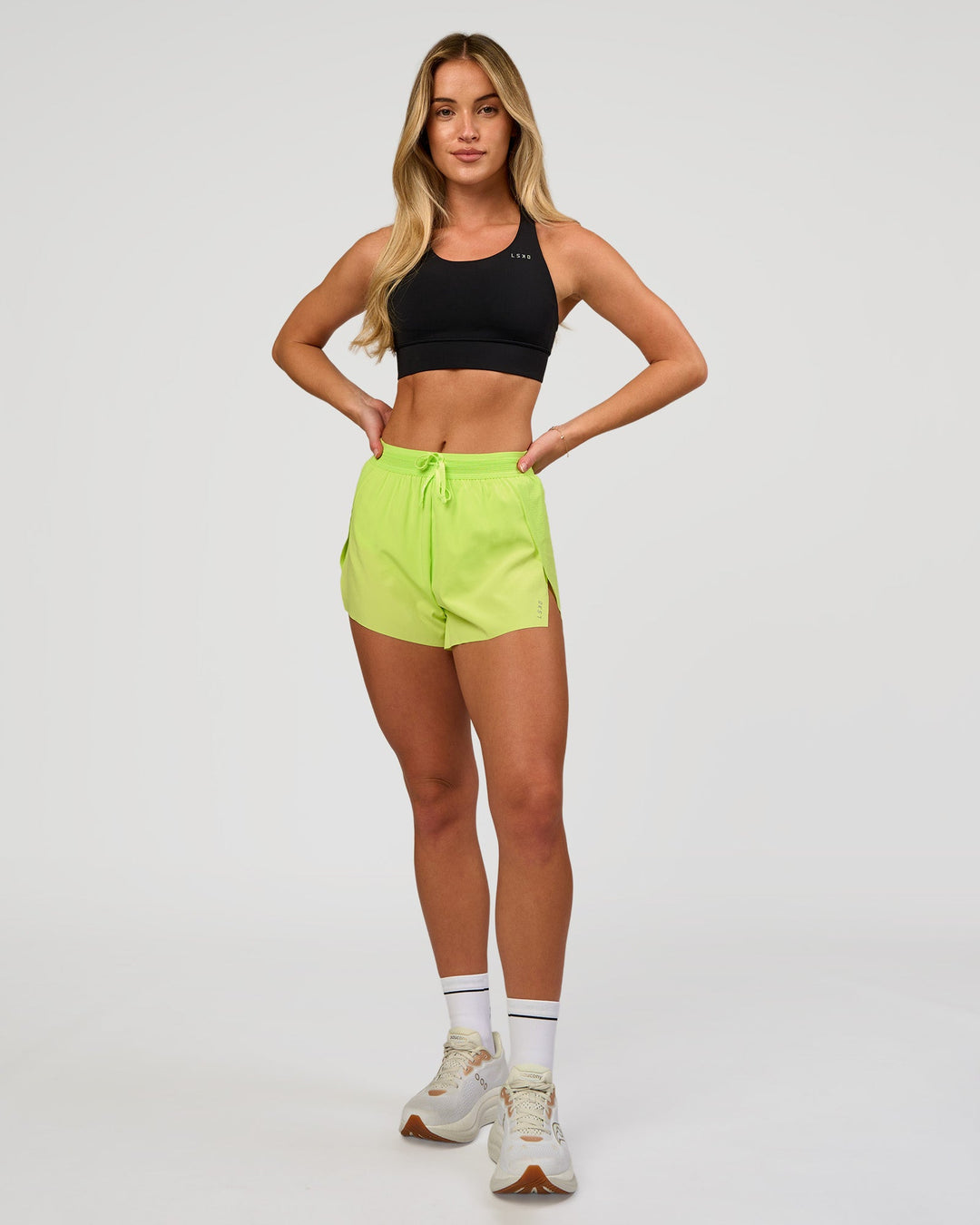 Woman wearing Accelerate 3" High-Rise Running Short in Hyper Green | Model:Issy | Sizze:XS