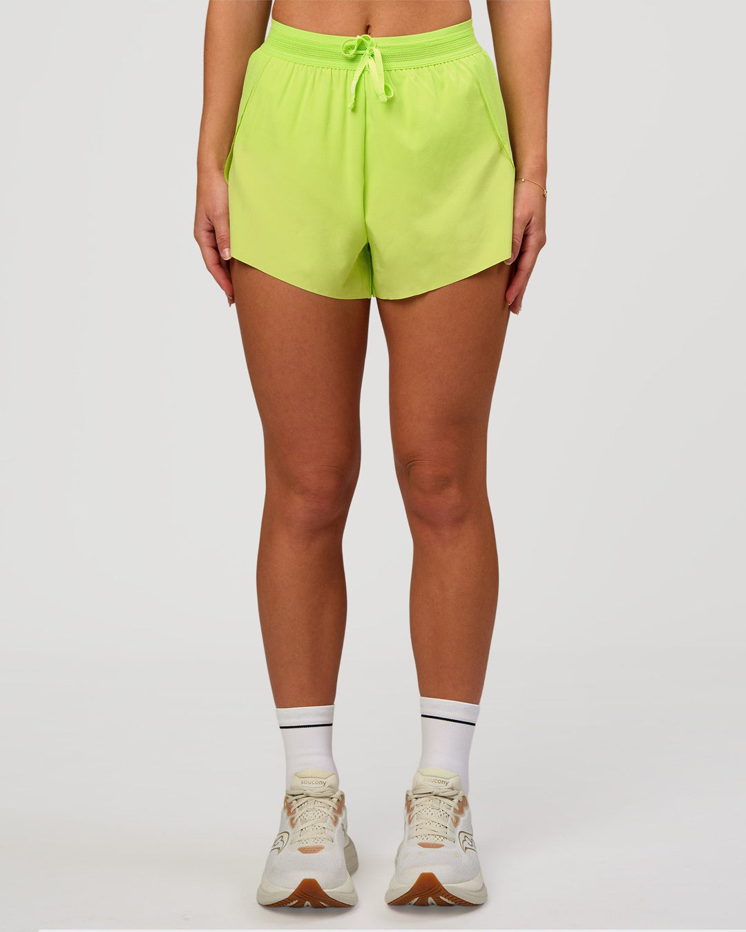 Woman wearing Accelerate 3" High-Rise Running Short in Hyper Green | Model:Issy | Sizze:XS