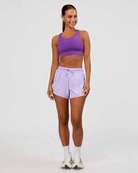 Woman wearing Accelerate 3" High-Rise Running Short - Pale Lilac | Model:Brylee | Size:XS
