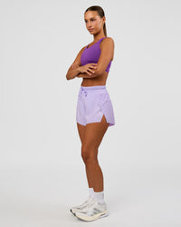 Woman wearing Accelerate 3" High-Rise Running Short - Pale Lilac | Model:Brylee | Size:XS