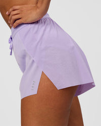 Woman wearing Accelerate 3" High-Rise Running Short - Pale Lilac | Model:Brylee | Size:XS