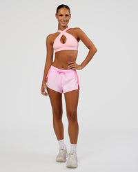 Woman wearing Accelerate 3" Mid-Rise Running Short - Candy Pink-Marshmallow | Model:Brylee | Size:XS