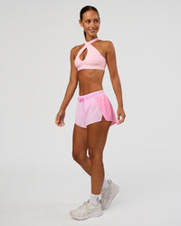 Woman wearing Accelerate 3" Mid-Rise Running Short - Candy Pink-Marshmallow | Model:Brylee | Size:XS