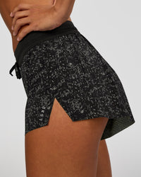 Woman wearing Accelerate 3" Mid-Rise Running Short - Energy Print Black | Model:Brylee | Size:XS