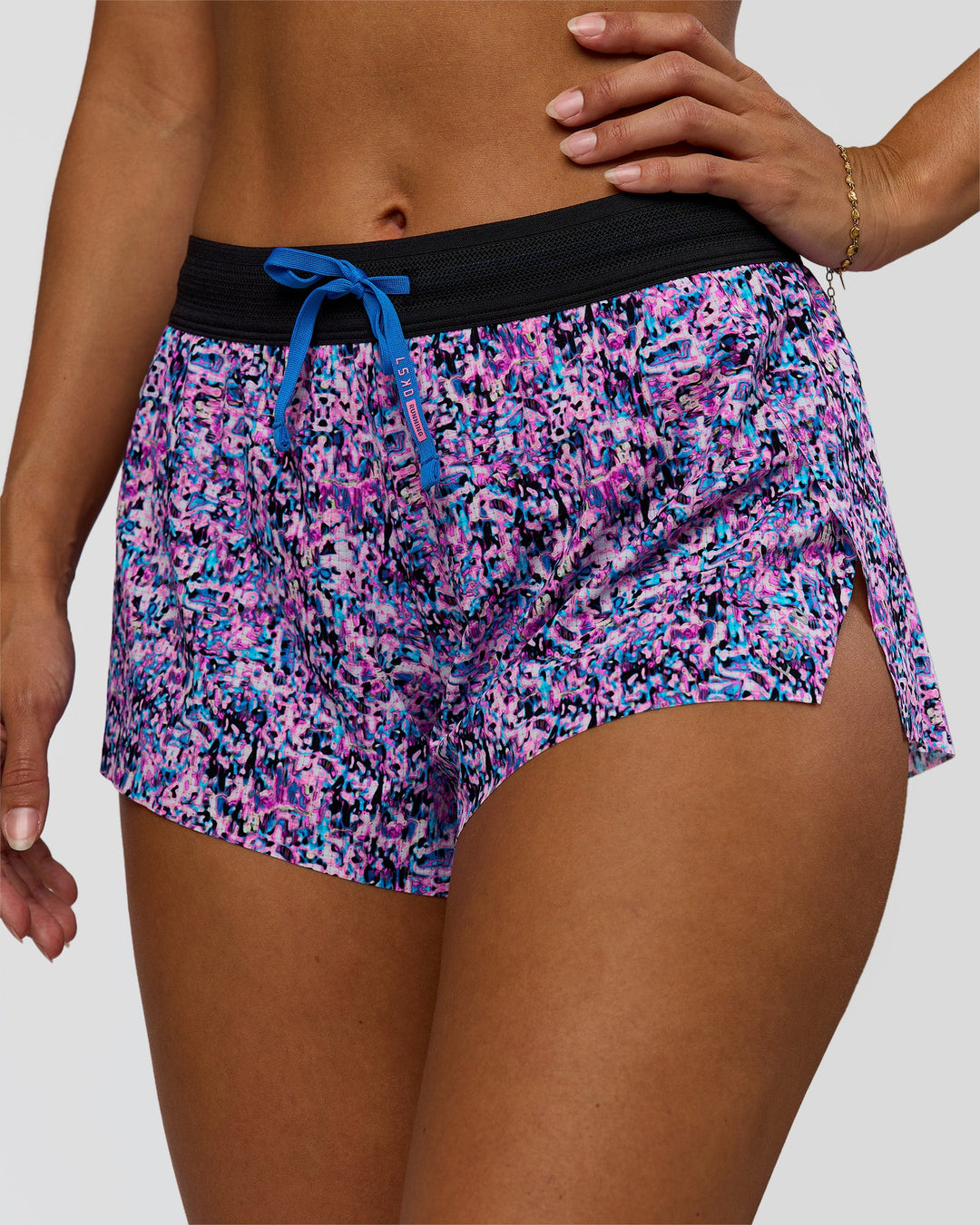 Woman wearing Accelerate 3" Mid-Rise Running Short in Energy Print Blue Multi | Model:Brylee | Size:XS - view 1