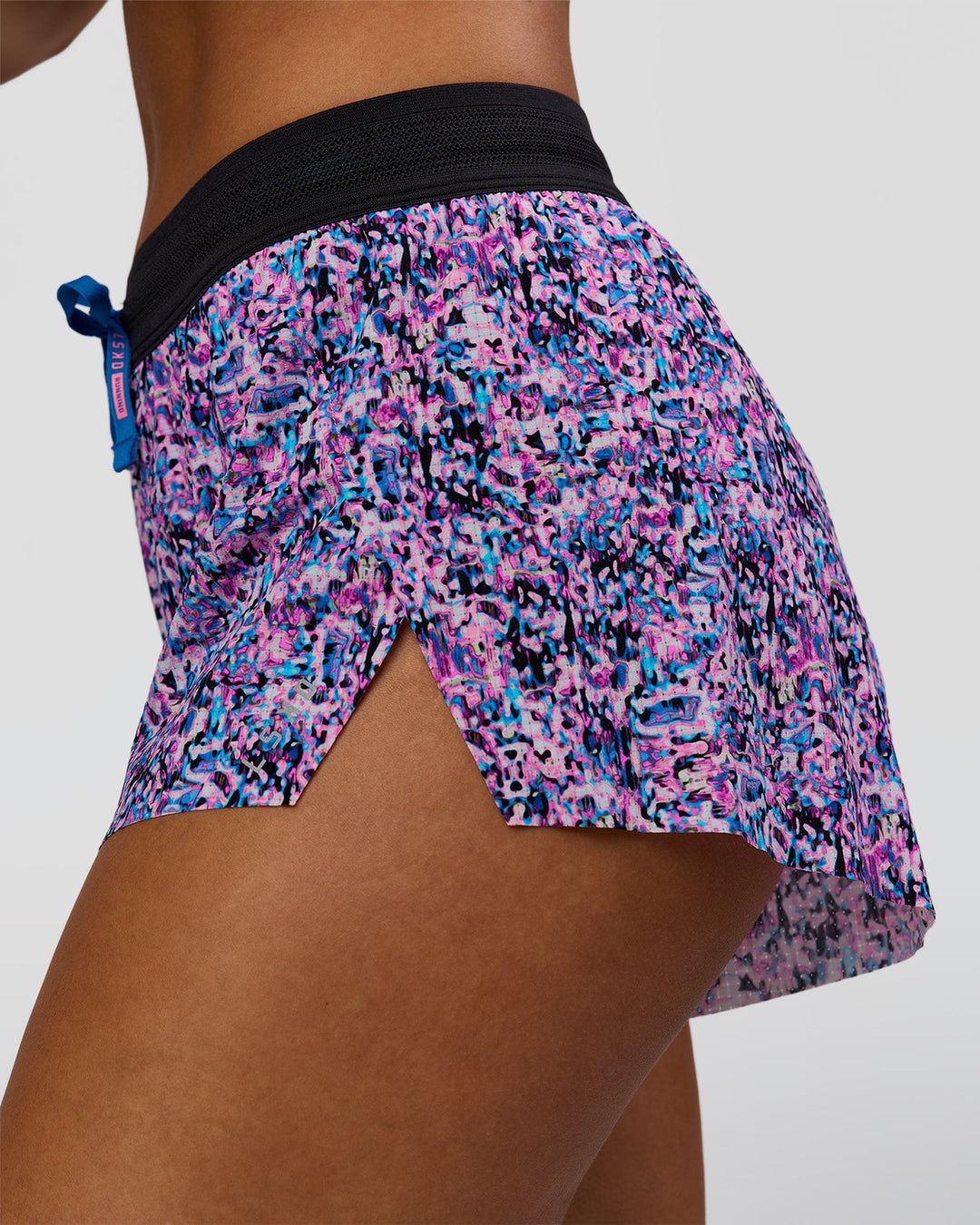 Woman wearing Accelerate 3" Mid-Rise Running Short in Energy Print Blue Multi | Model:Brylee | Size:XS - view 2