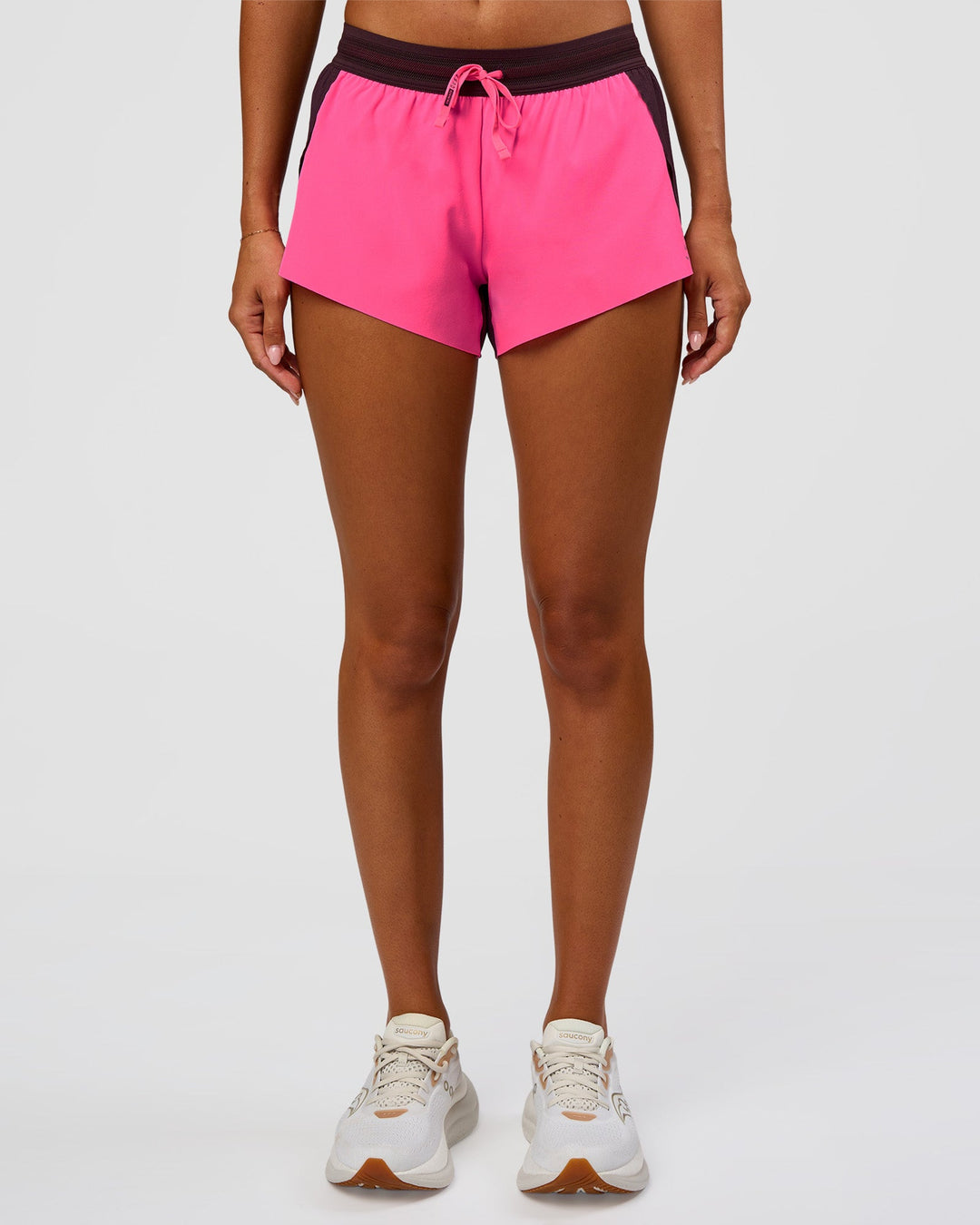 Woman wearing Accelerate 3" Mid-Rise Running Short - Midnight Plum-Sugar Plum | Set:True | Angle:front | Model:Charli | Size:XS