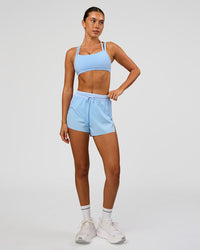 Woman wearing Accelerate 3" High-Rise Running Short in Open Air | Model:Charli | Size:XS