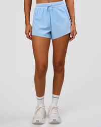 Woman wearing Accelerate 3" High-Rise Running Short in Open Air | Model:Charli | Size:XS