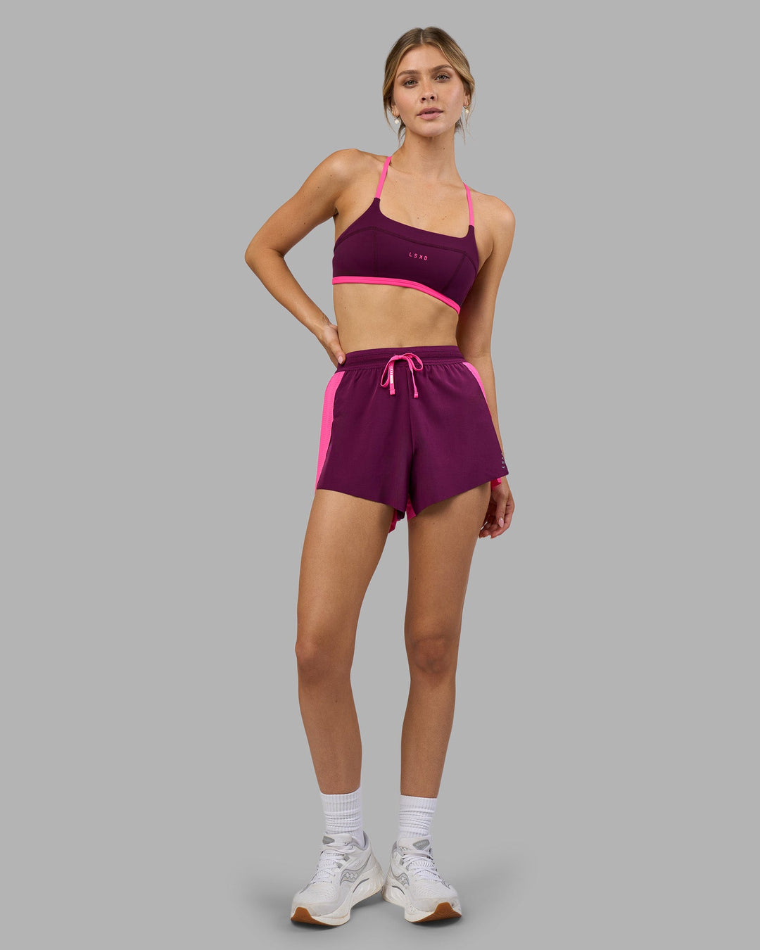 Woman wearing Accelerate 3&quot; High-Rise Running Short - Ultra Pink-Plum Caspia | Model:Leilani | Size:XS