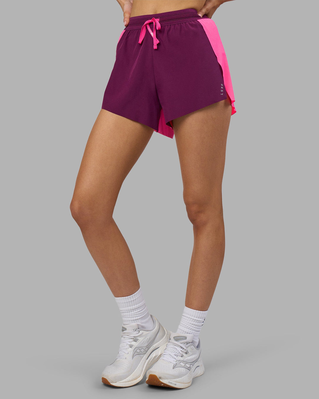 Woman wearing Accelerate 3&quot; High-Rise Running Short - Ultra Pink-Plum Caspia | Model:Leilani | Size:XS