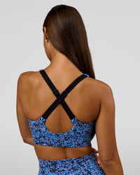 Woman wearing Accelerate Sports Bra in Energy Print Blue Multi | Model:Brylee | Size:XS | Thumbnail Index: 1