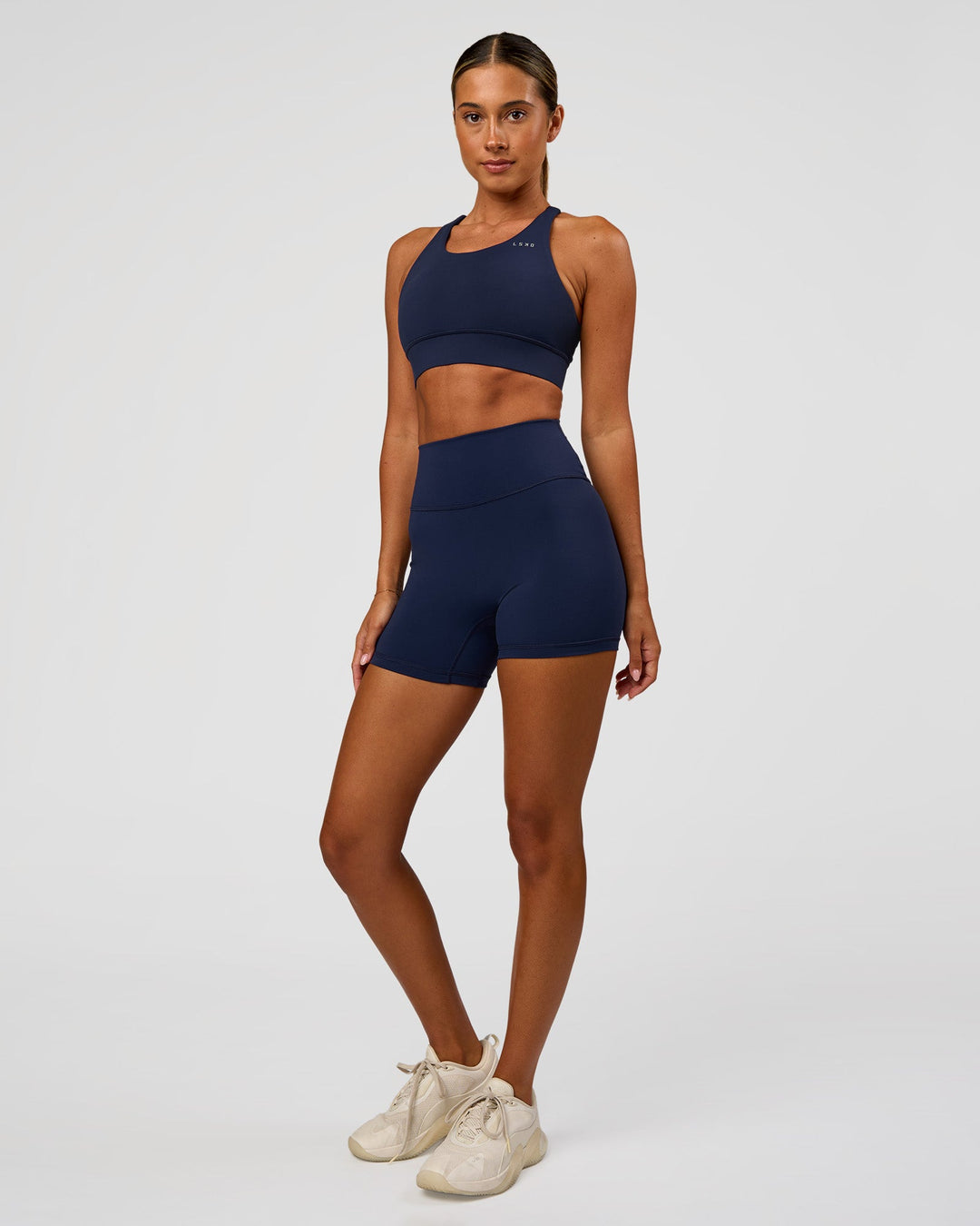 Woman wearing Accelerate Sports Bra - Future Navy | Model:Charlie | Size:XS
