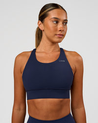 Woman wearing Accelerate Sports Bra - Future Navy | Model:Charlie | Size:XS