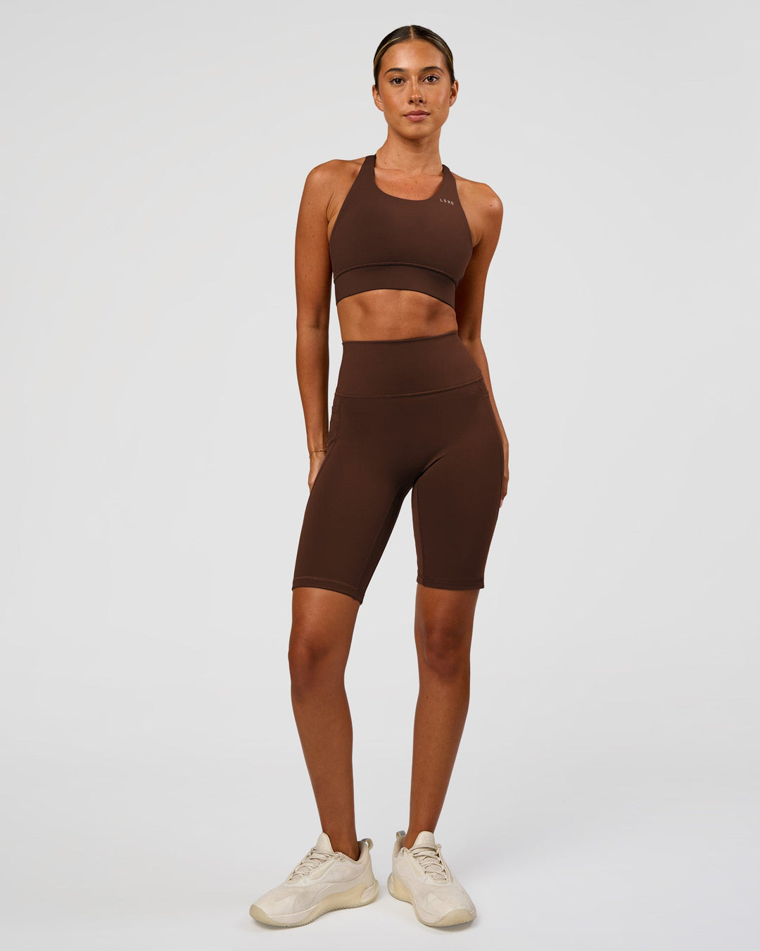 Woman wearing Accelerate Sports Bra - Hot Chocolate | Model:Charli | Size:XS - view 6