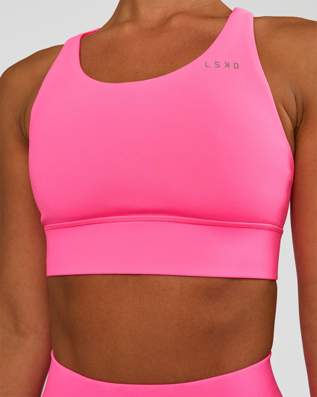 Woman wearing Accelerate Sports Bra - Sugar Plum | Set:true | Angle:closeup | Model:Brylee | Size:XS - view 1