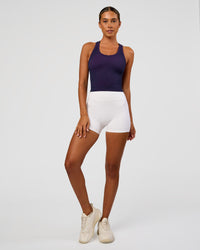 Woman wearing Activate Seamless Ribbed Shelf Bra Tank - Future Navy-Ultra Fuchsia | Model:Charli | Size:XS