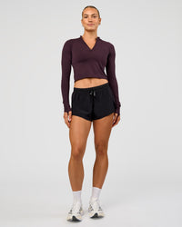 Woman wearing AeroFLX+ Long Sleeve Skimmer Half Zip - Midnight Plum/Midnight Plum | Model:Maja | Size:XS | Thumbnail Index: 5