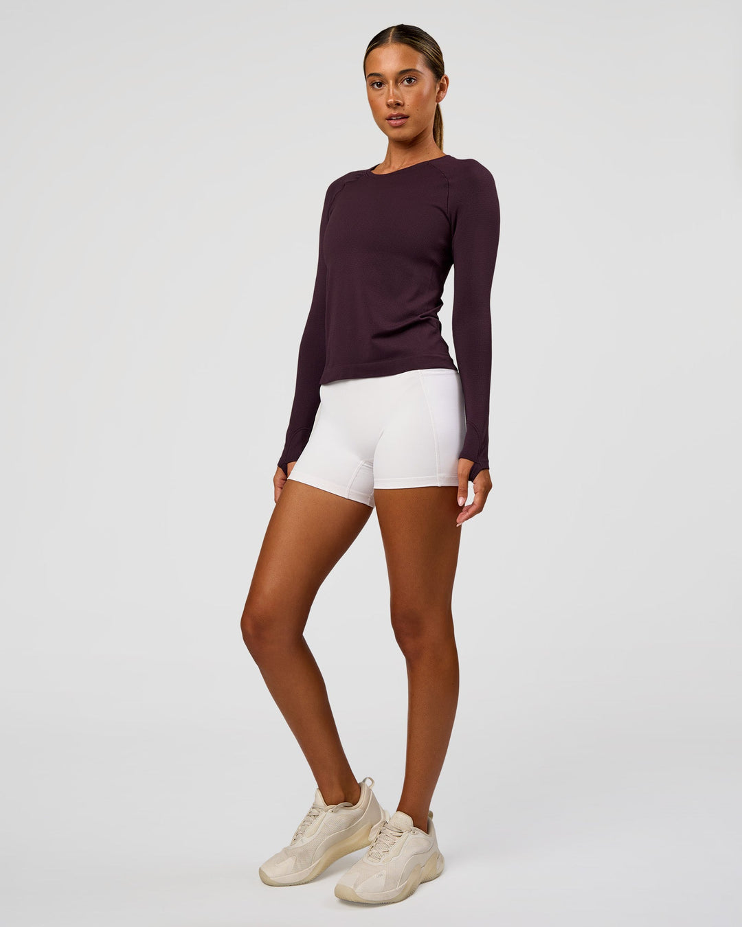 Woman wearing AeroFLX+ Seamless Long Sleeve Tee - Midnight Plum/Midnight Plum | Model:Charli | Size:XS