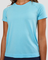 Woman wearing AeroFLX+ Seamless Tee - Baltic Sea/Baltic Sea | Model:Dakota | Size:XS