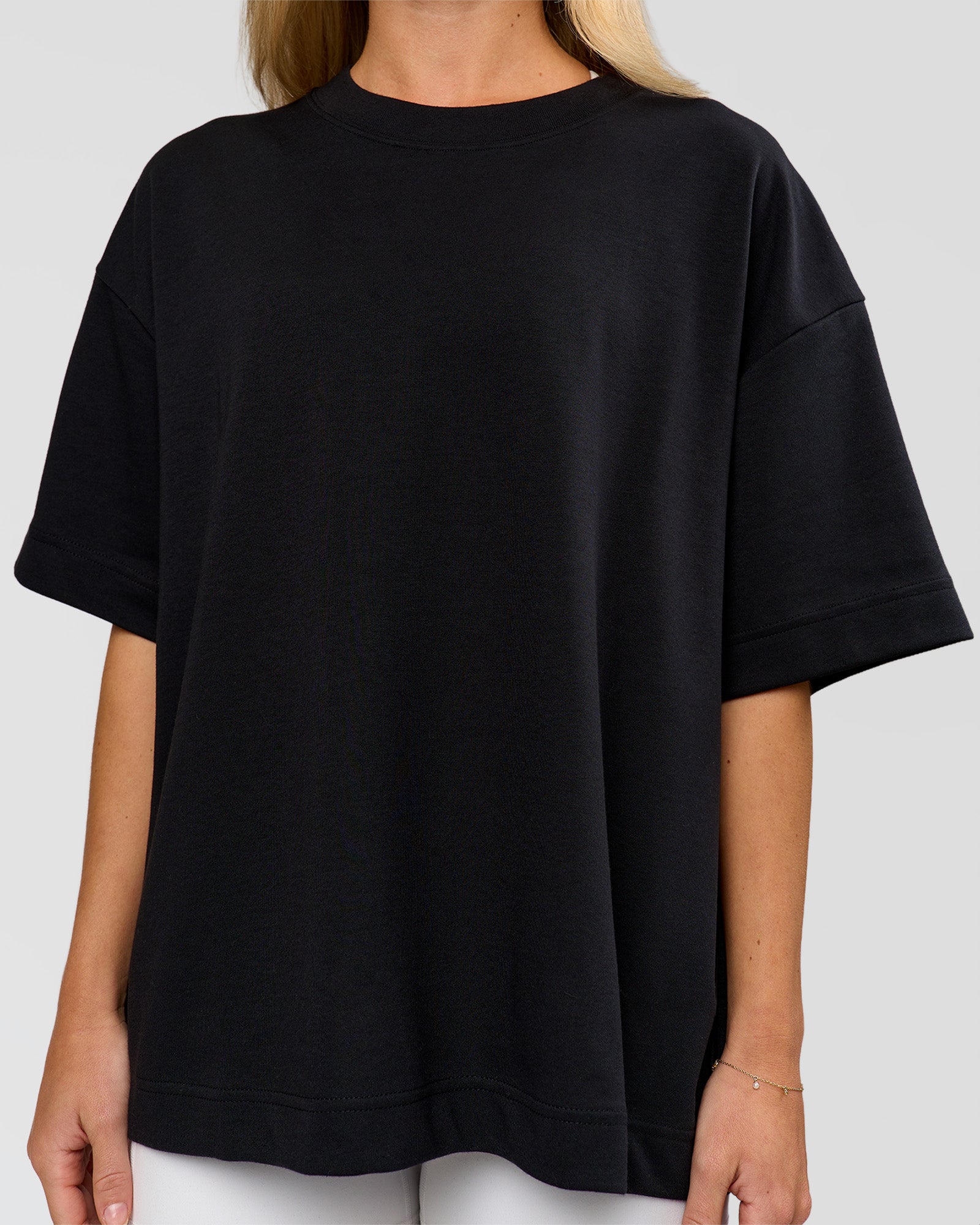 Woman wearing AfterDark ZeroCrease Boxy Tee in Black | Model:Issy | Size:XS