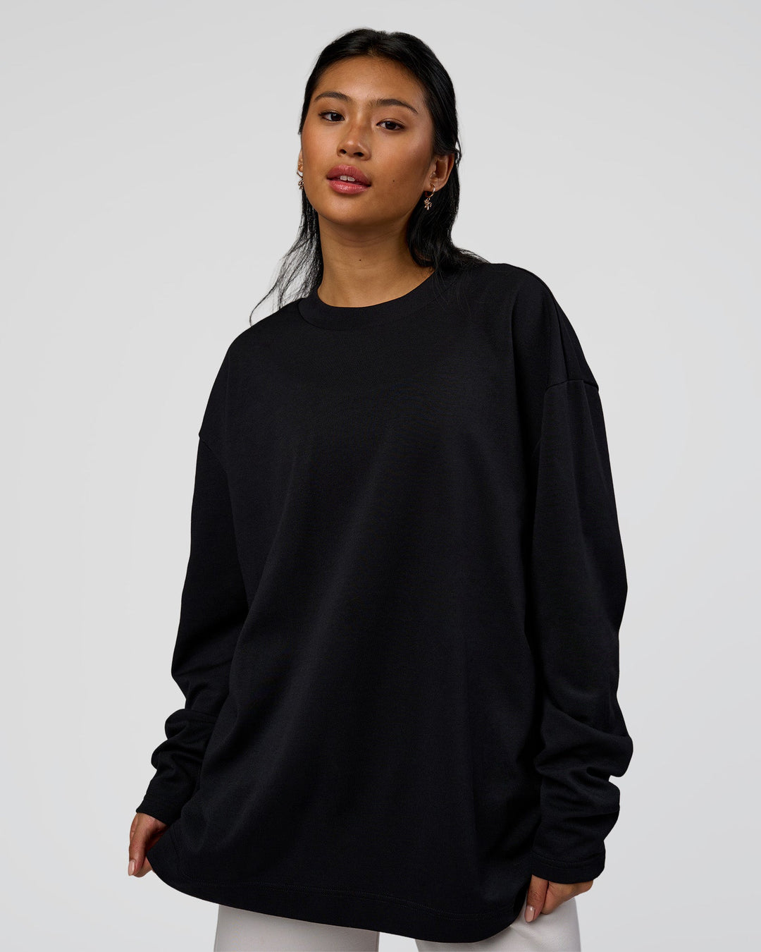 Woman wearing AfterDark ZeroCrease Long Sleeve Tee - Black | Model:Loren | Size:XS