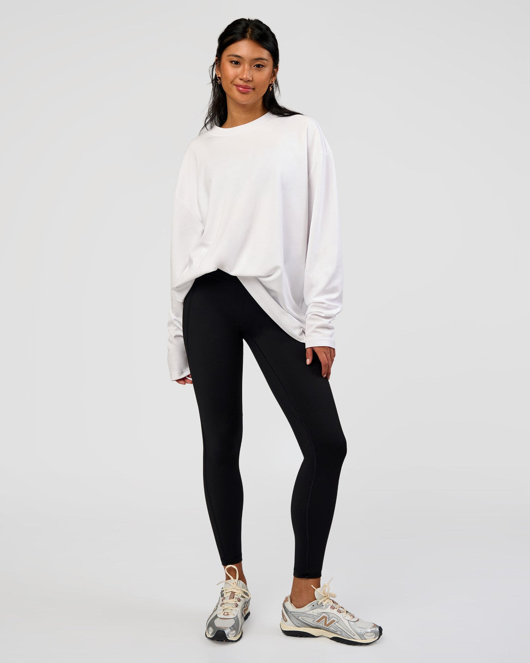 Woman wearing AfterDark ZeroCrease Long Sleeve Tee - White | Model:Loren | Size:XS