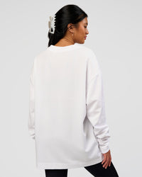 Woman wearing AfterDark ZeroCrease Long Sleeve Tee - White | Model:Loren | Size:XS