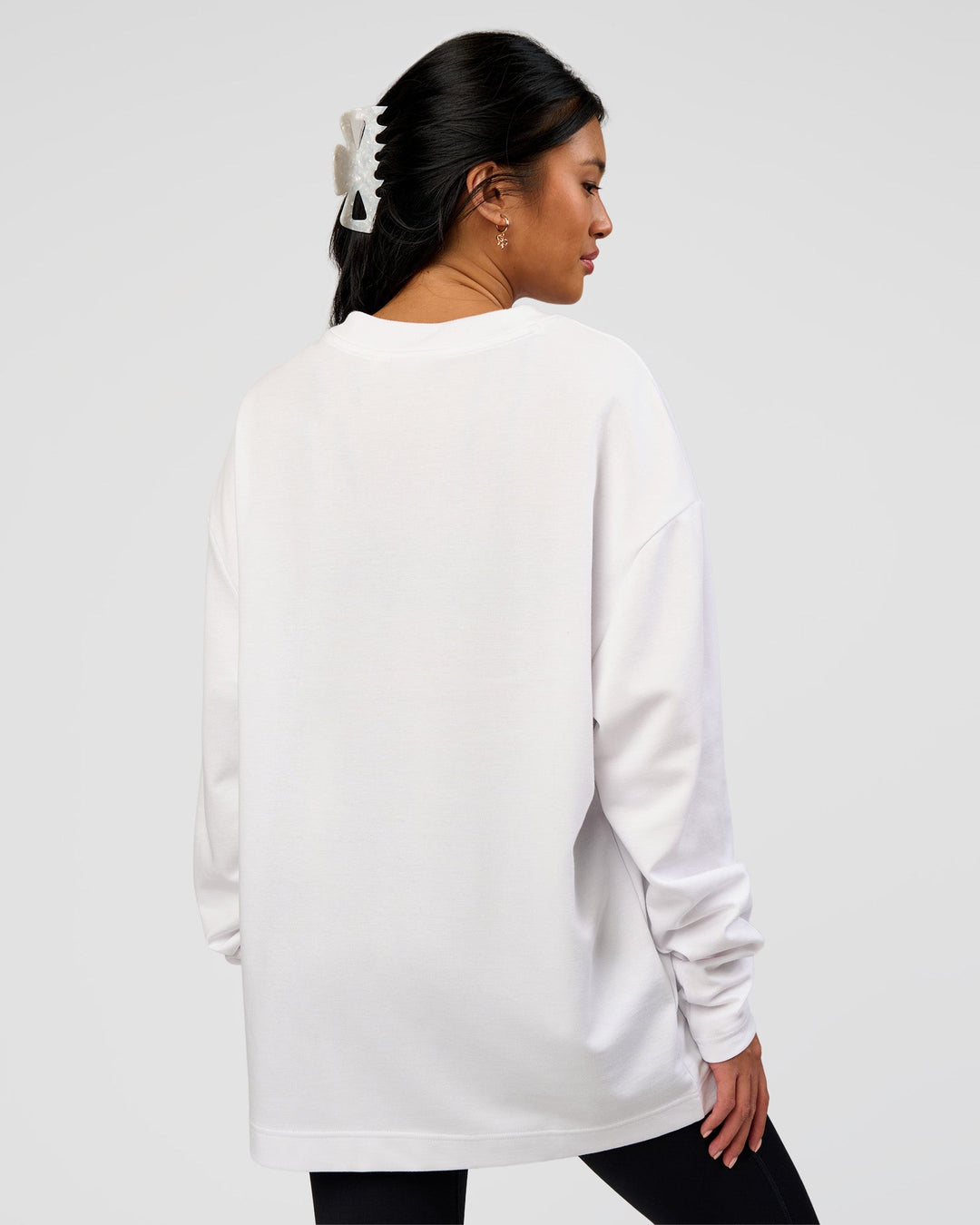 Woman wearing AfterDark ZeroCrease Long Sleeve Tee - White | Model:Loren | Size:XS