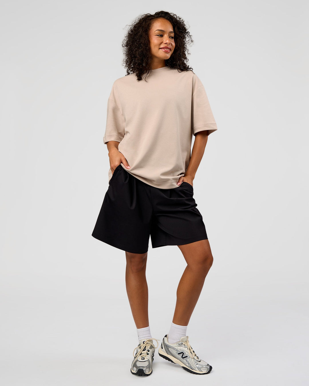 Woman wearing AfterDark ZeroCrease Oversized Tee - Shale Beige | Model:Jasmine | Size:XS - view 5