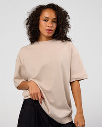 Woman wearing AfterDark ZeroCrease Oversized Tee - Shale Beige | Model:Jasmine | Size:XS | Thumbnail Index: 3